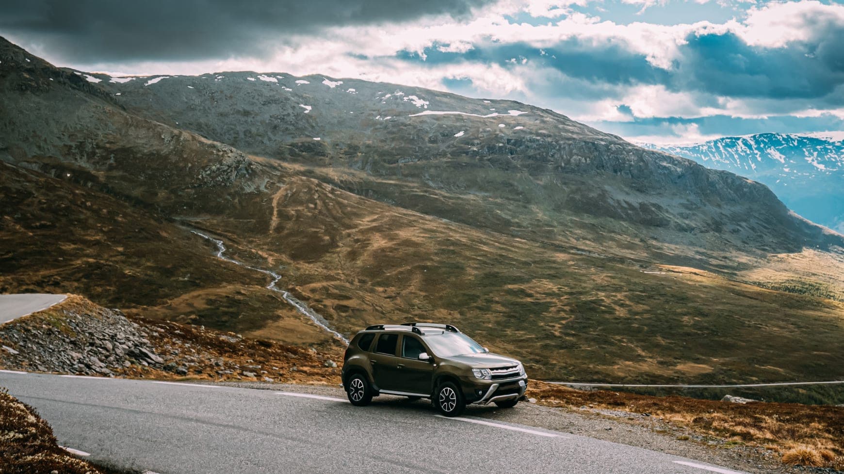 SUV Parked on a Mountain Side
